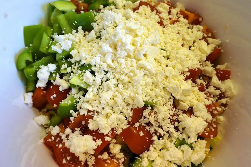 greek pasta salad ingredients, peppers, tomatoes, feta cheese, cucumbers, leeks